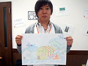 自動雪かき装置の絵を
掲げているところ